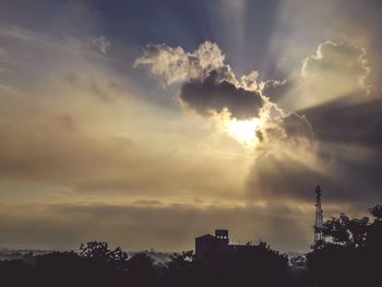 Low angle view of silhouette trees against sky during sunset