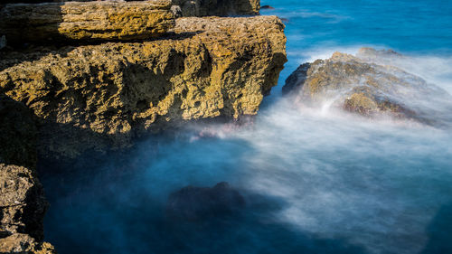 Scenic view of rock formation in sea