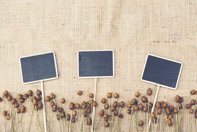 Directly above shot of blank slates with ropes on table