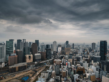 High angle view of buildings in city against sky