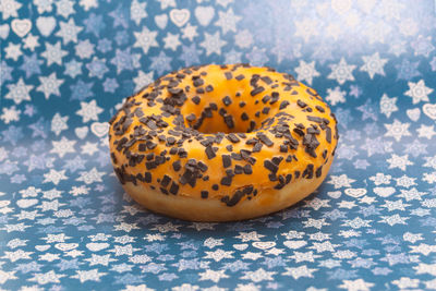 Close-up of bread on table against blue background