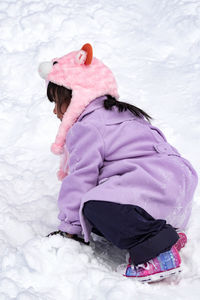 High angle view of girl in snow