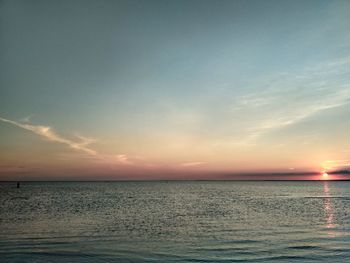 Scenic view of sea against sky at sunset