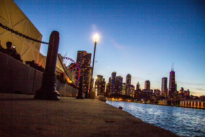 View of city buildings against clear sky