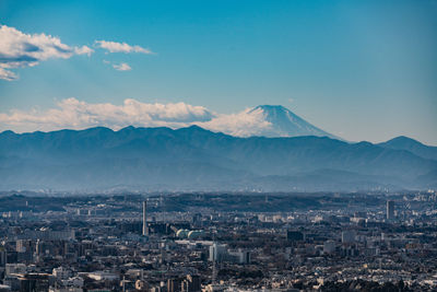 Aerial view of cityscape against sky