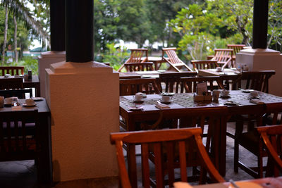 Empty chairs and table at restaurant