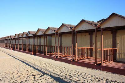 Built structure on beach against clear sky