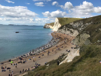 High angle view of people on beach against sky