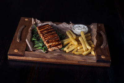 High angle view of food on table against black background