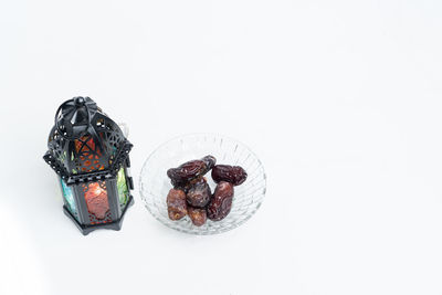 High angle view of cake on table against white background