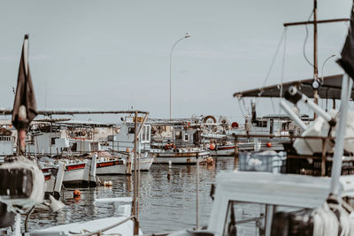 Boats moored at harbor