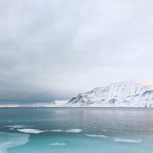 Scenic view of sea against sky during winter