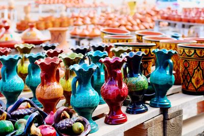 Close-up of various vases for sale in market