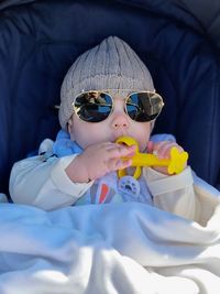 Portrait of cute boy wearing sunglasses
