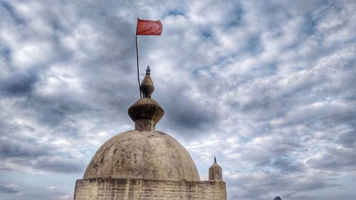 Low angle view of statue against sky