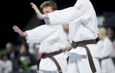 Karate men practicing in studio