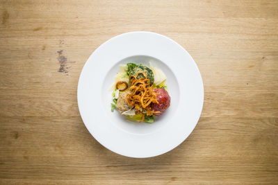 High angle view of vegetables in plate on table