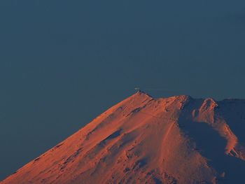 Low angle view of mountain at sunset