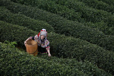 Portrait of farmer in traditional clothing working at farm