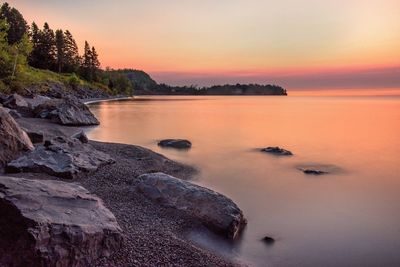 Scenic view of sea against sky at sunset