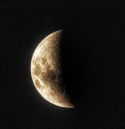 Low angle view of moon against sky at night