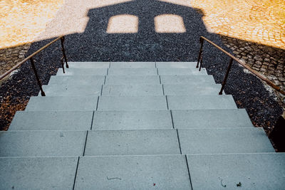 High angle view of stairs by railing