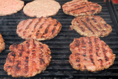 High angle view of meat on barbecue grill