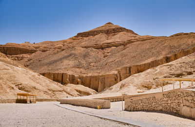 Scenic view of arid landscape against clear sky