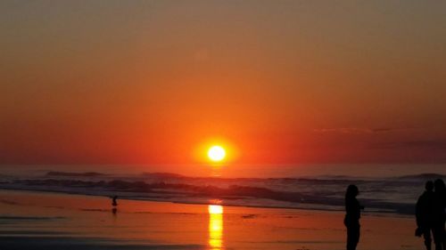 Scenic view of sea at sunset