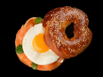 Close-up of donut on black background