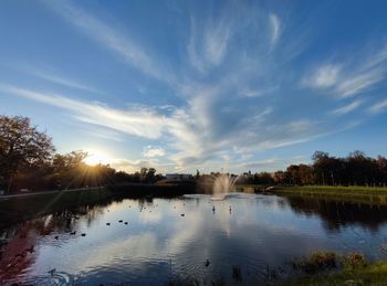 Scenic view of lake against sky during sunset