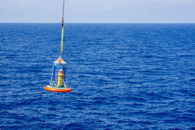 A personal transfer basket being used to transport offshore workers at offshore terengganu oil field