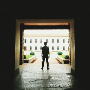 Full length of woman standing in building