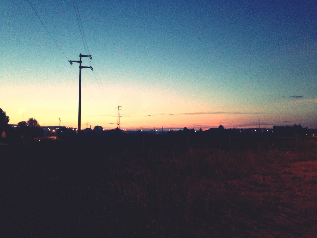 sunset, silhouette, electricity pylon, copy space, power line, clear sky, landscape, electricity, sky, street light, tranquility, tranquil scene, field, fuel and power generation, scenics, dusk, nature, power supply, beauty in nature, blue