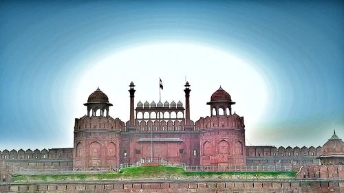 Low angle view of fort against clear blue sky