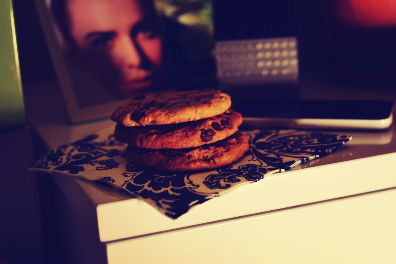 indoors, food and drink, close-up, food, sweet food, table, focus on foreground, unhealthy eating, home interior, indulgence, holding, dessert, still life, person, lifestyles, selective focus, front view, cake