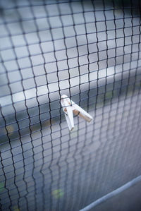 High angle view of metal fence by water