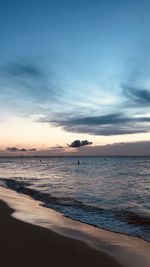 Scenic view of beach against sky during sunset in aruba