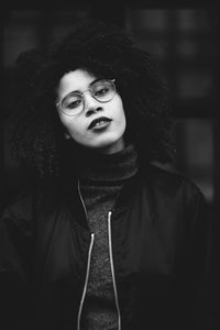 Portrait of teenage girl wearing warm clothing standing outdoors