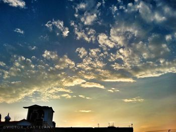 Low angle view of silhouette building against sky during sunset