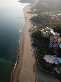 High angle view of sea and cityscape