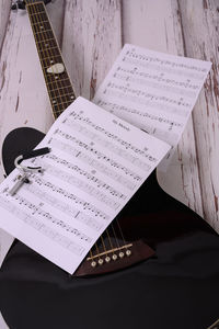 High angle view of guitar on table