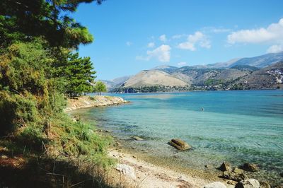 Scenic view of bay against sky