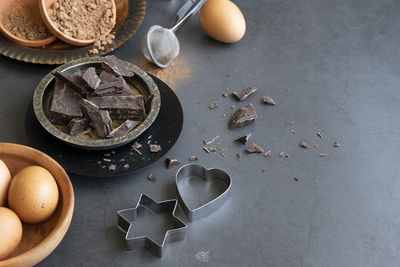 Mix of baking dessert ingredients on dark background, culinary flat lay