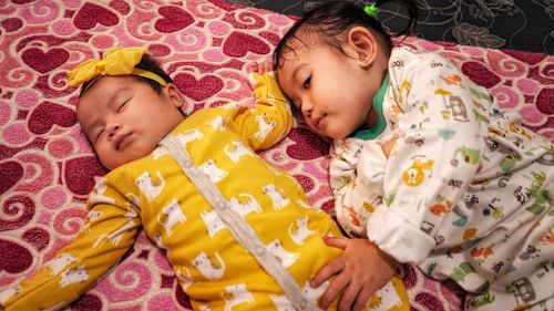 Cute baby sleeping on bed