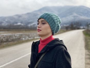 Close-up of young woman standing on road