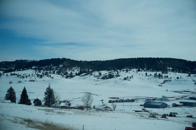 Scenic view of landscape against sky during winter