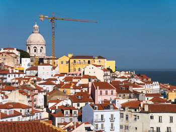 View of cityscape against blue sky