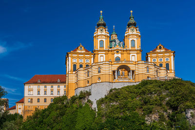 Low angle view of building against blue sky