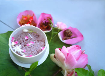 Close-up of pink roses on table